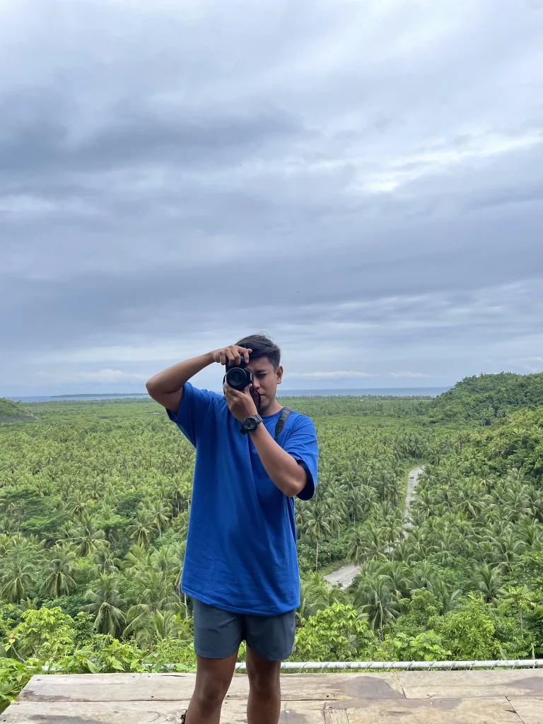 Man holding a camera taking a photo